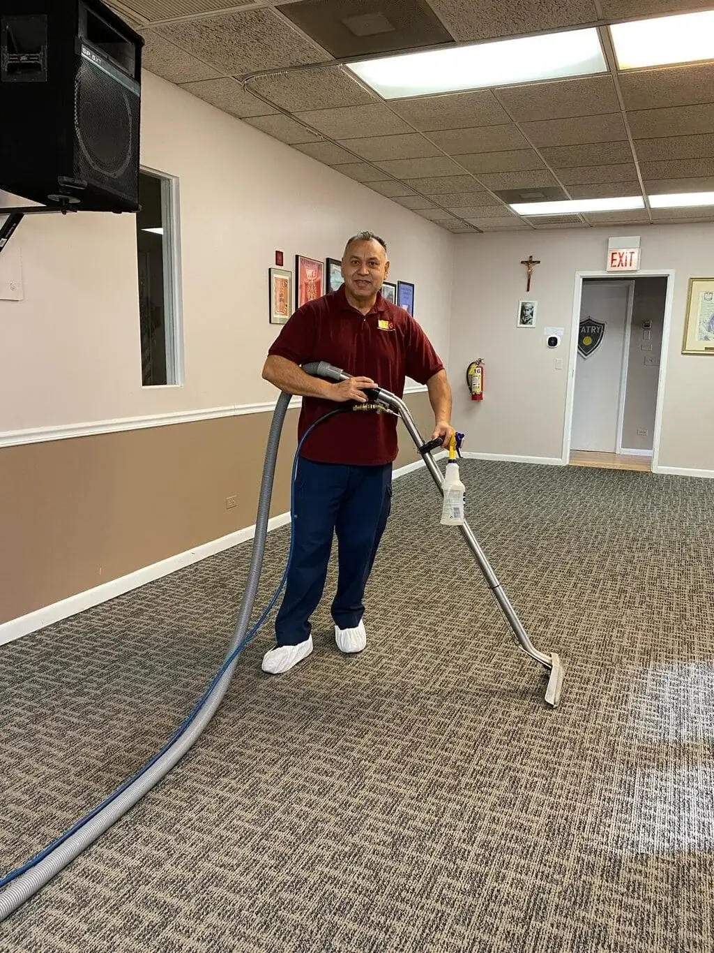 Carpet Cleaning Group technician steam cleaning commercial carpet inside a Chicago church using professional equipment