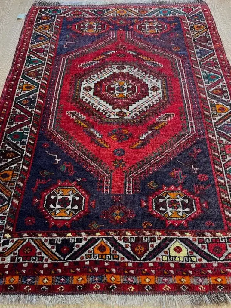 Red and navy Persian rug after cleaning by Carpet Cleaning Group, serving West Ridge, Chicago