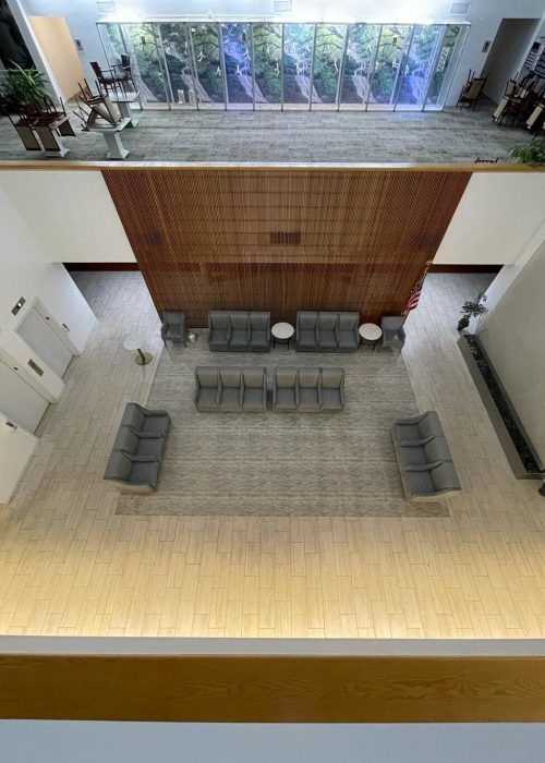Aerial view of a professionally cleaned commercial office lobby atrium with carpet and tile floors in Chicago