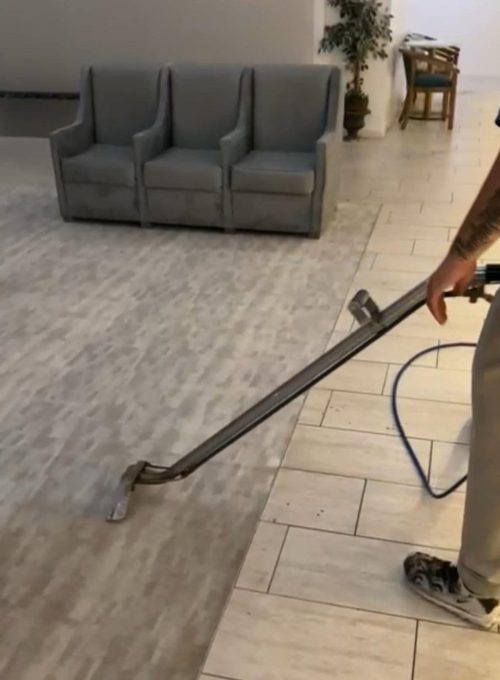 Carpet Cleaning Group technician steam cleaning commercial lobby tile floor in a Chicago business