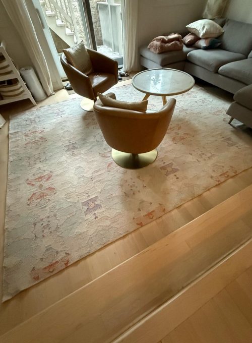 Professionally cleaned vintage floral area rug in a Chicago home living room by Carpet Cleaning Group