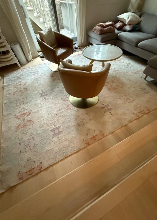 Professionally cleaned vintage floral area rug in a Chicago home living room by Carpet Cleaning Group
