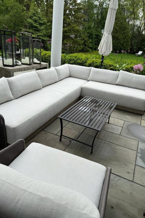 White outdoor patio sectional sofa professionally cleaned by upholstery cleaning service in Chicago