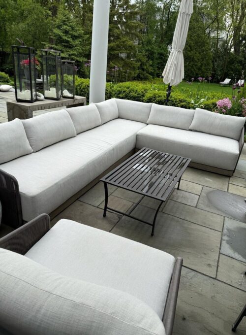 White outdoor patio sectional sofa professionally cleaned by upholstery cleaning service in Chicago